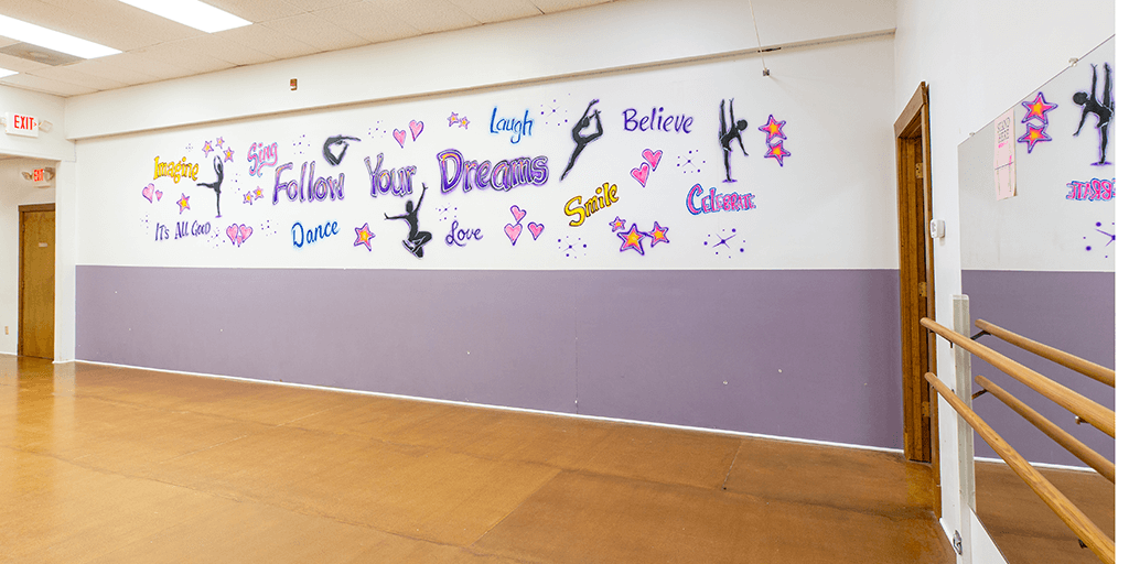 Airbrushed artwork on dance studio wall