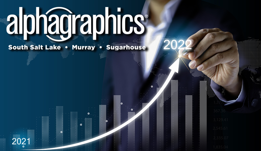 Businessman draw on point arrow graph economic growth target success from 2021 to 2022.