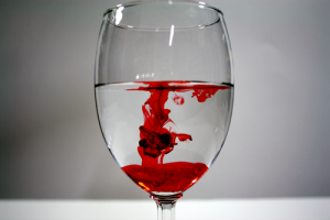 Red Food Coloring Dropped In White Wine