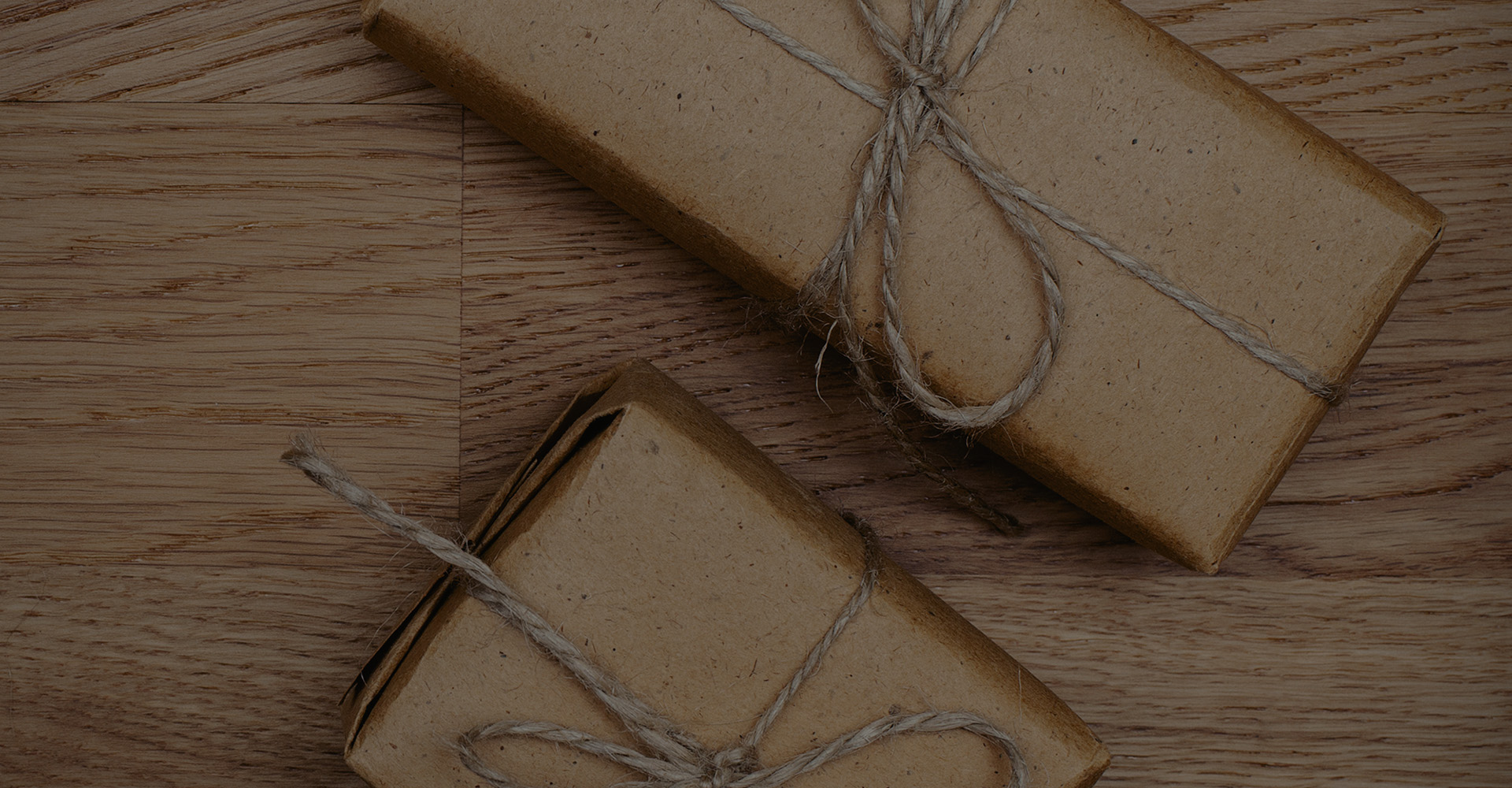 Packages wrapped in brown paper and tied with twine.