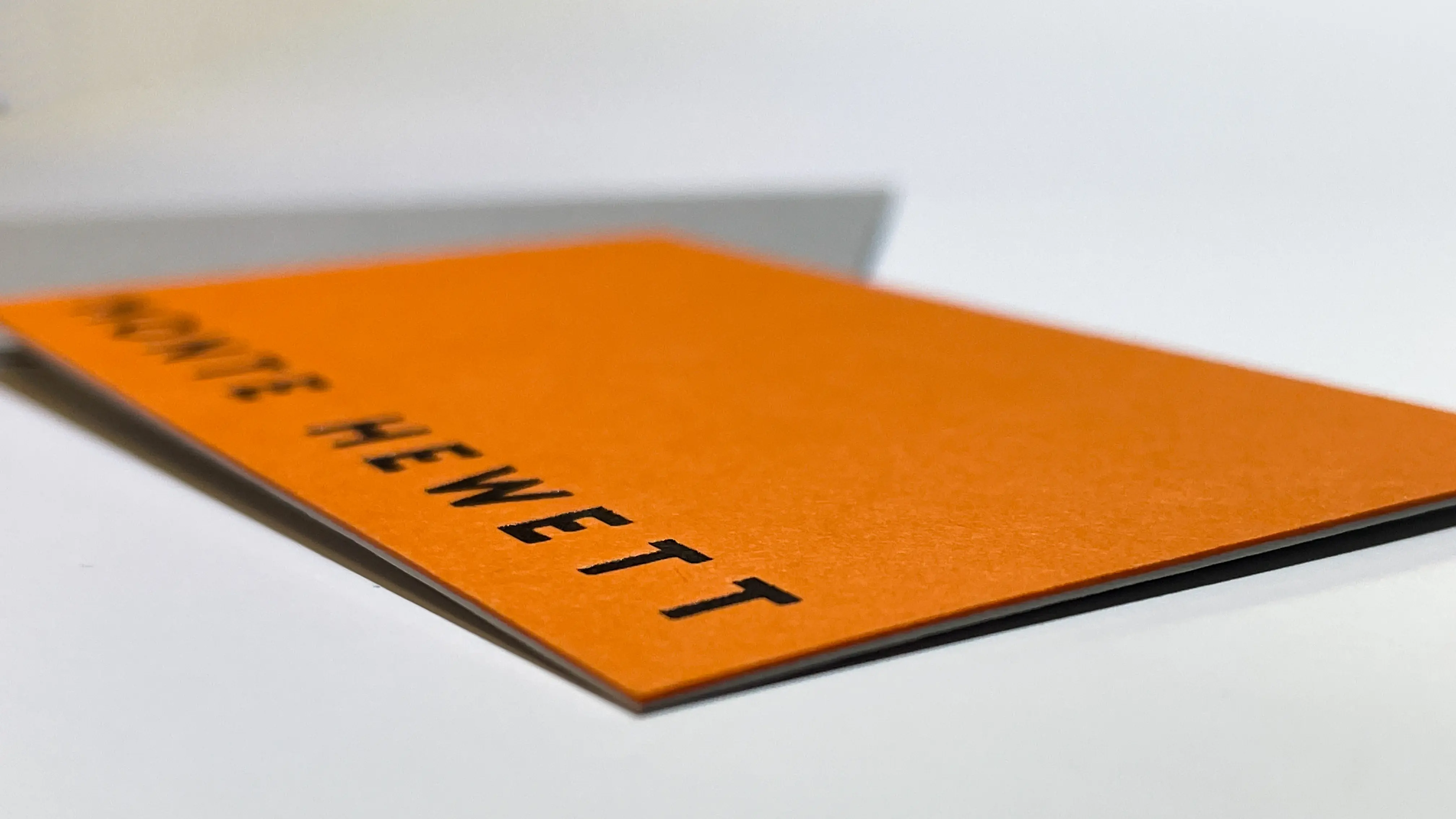 An image of a bright orange business card.
