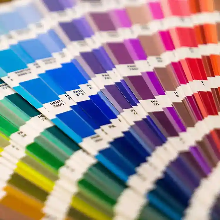 An image of a Pantone swatch book with various colors.