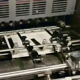 A photo of an offset press running.