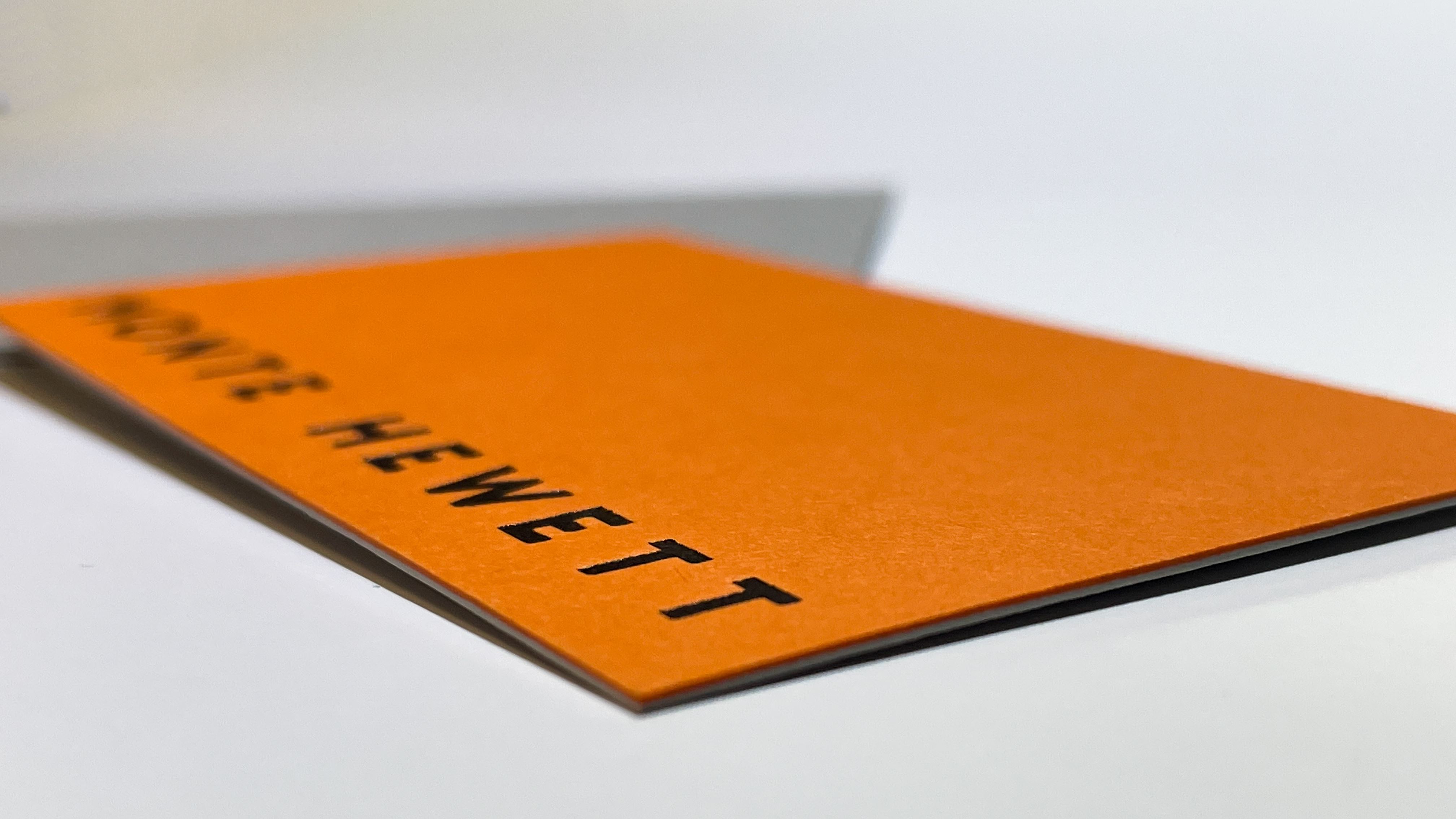 A business card with the letterpress design.
