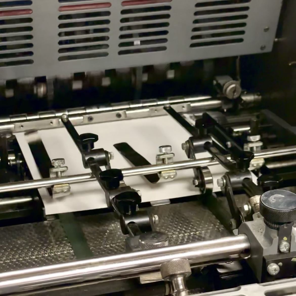 An image of an offset printing press running.