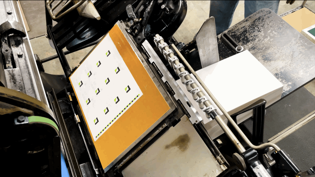 An image showing a letterpress machine running.