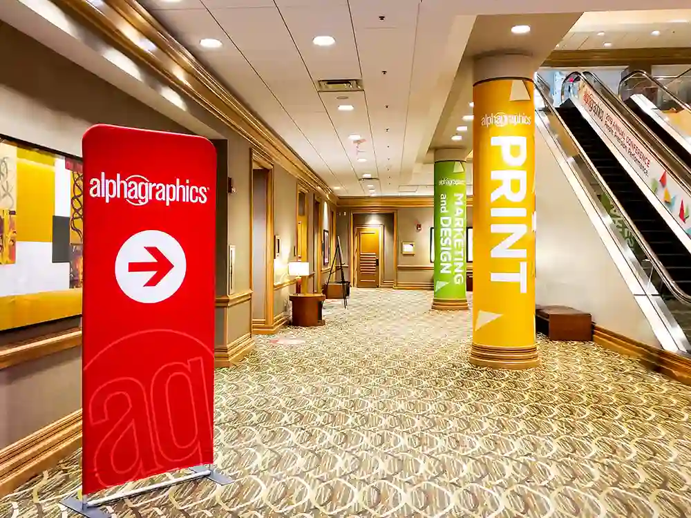 An image of a banner stand at a convention.