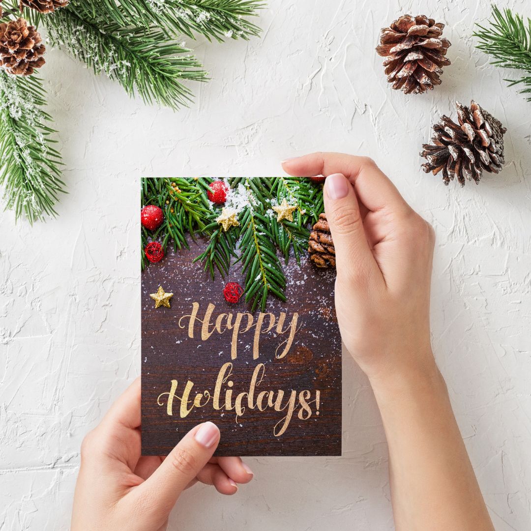 person holding holiday card