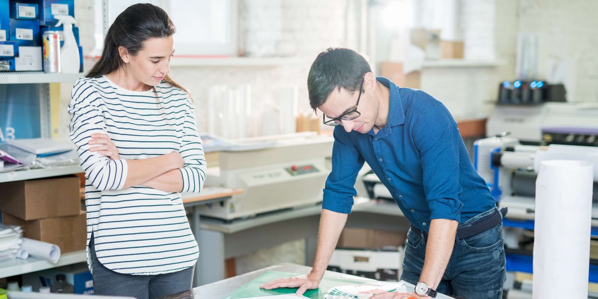 Two employees working on a large scale project