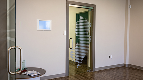 Glass Lobby Door with custom cut out New Jersey Logo