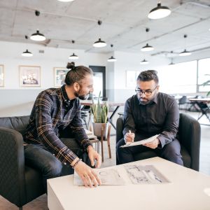 Two small business executives going over their business model