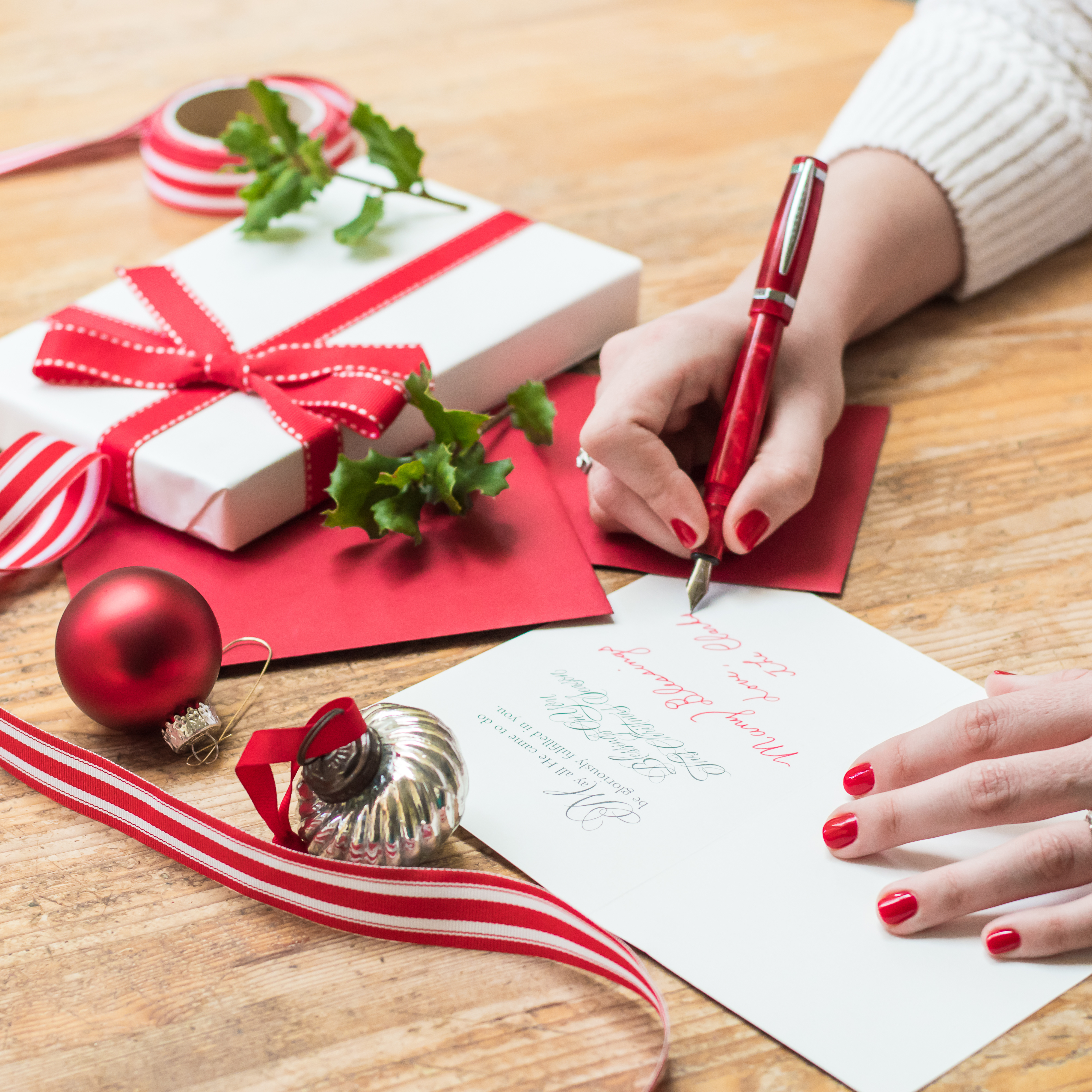 Woman's Hand writing holiday card