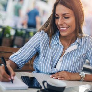 A woman happily working remote