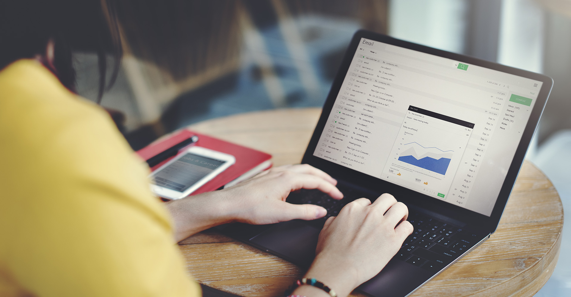 A woman looking at marketing details on her laptop