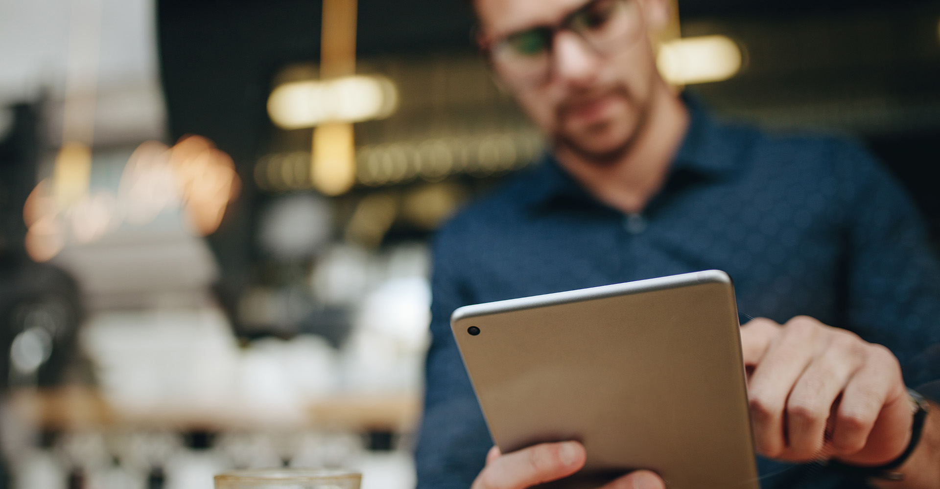 A business owner on a tablet at work