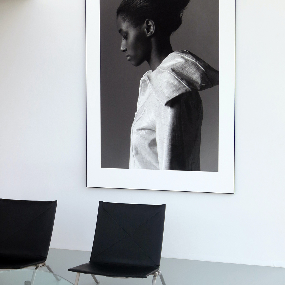 A black and white poster of a girl inside a business