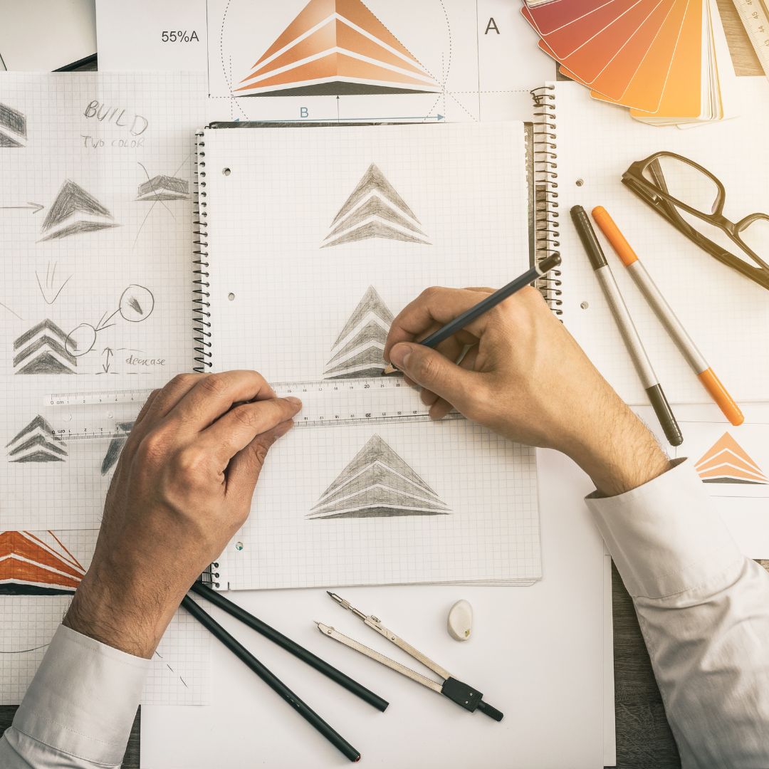man drawing a logo