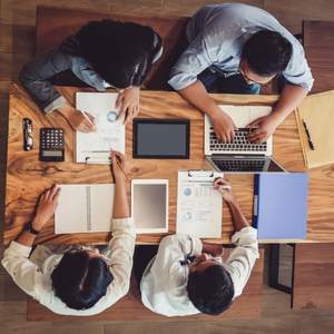 Top view of a table where business partners meet for a financial meeting