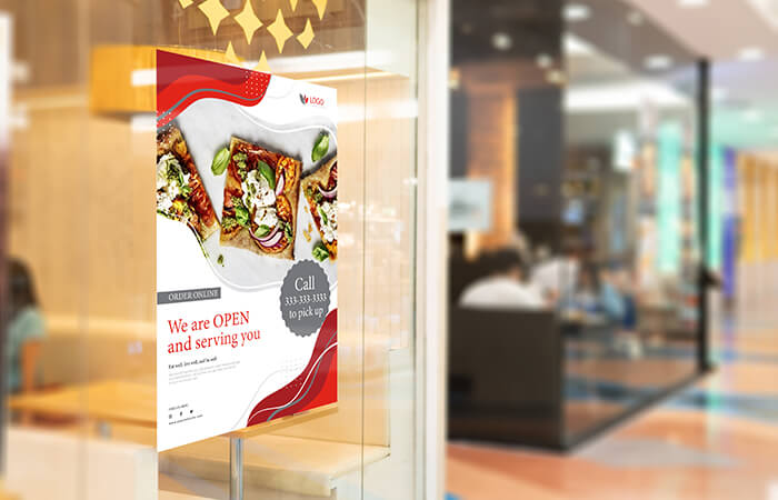 Poster on the glass window of a restaurant