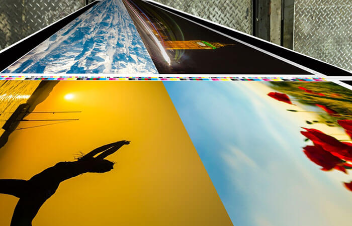 Colorful photos coming out of a large-format printer