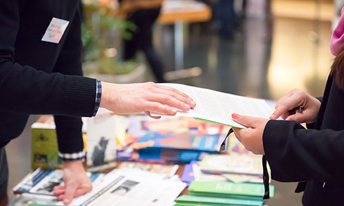 Trade show printed materials on a table