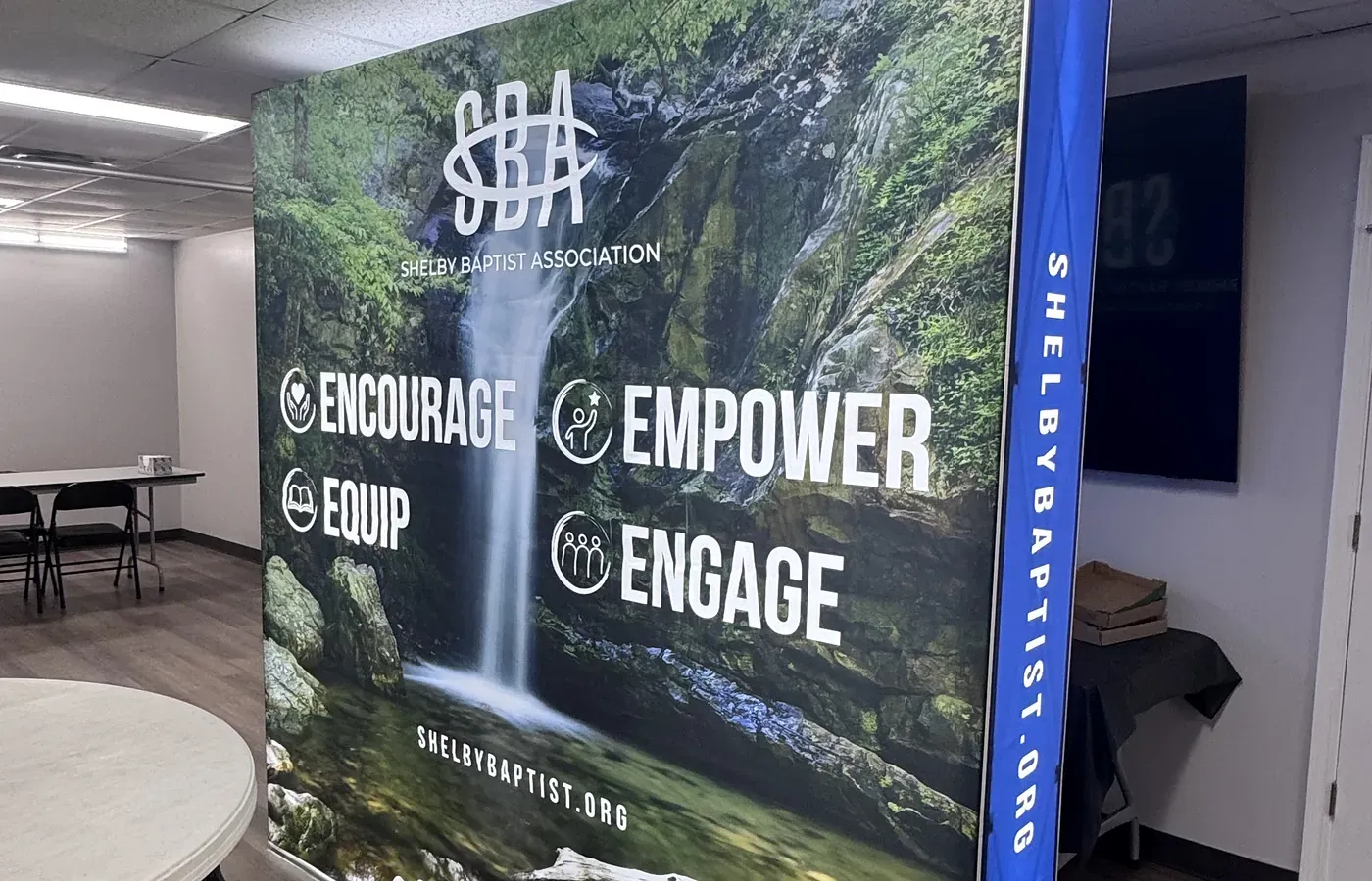 Custom backlit fabric display with a waterfall graphic for Shelby Baptist Association, printed by AlphaGraphics Hoover