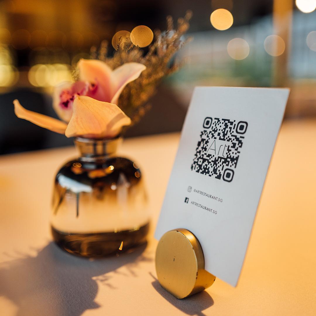 A QR code card on a restaurant table 