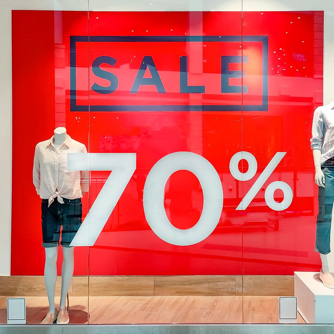 A large sale sign in a department store