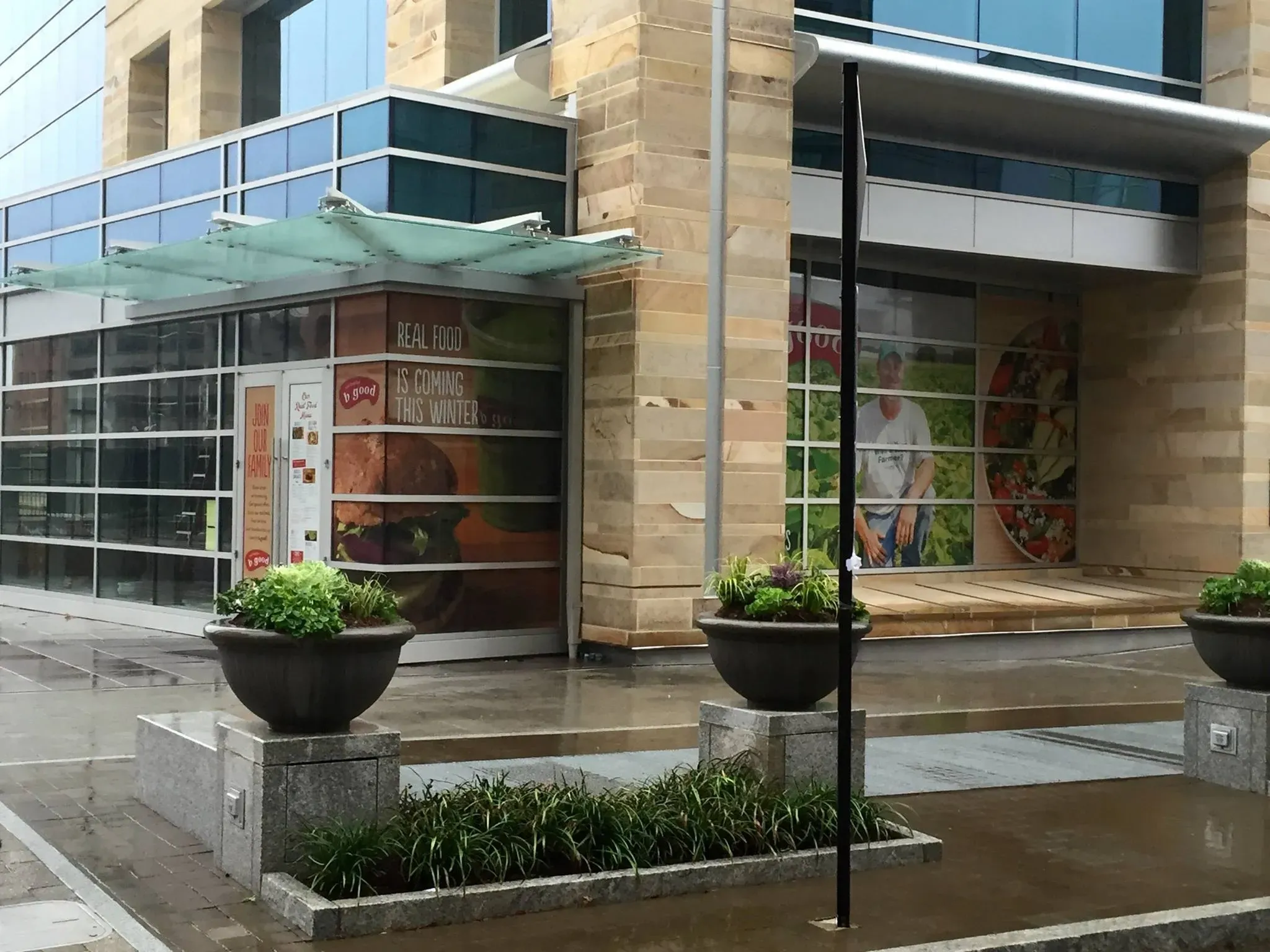 Window graphics at a modern building entrance
