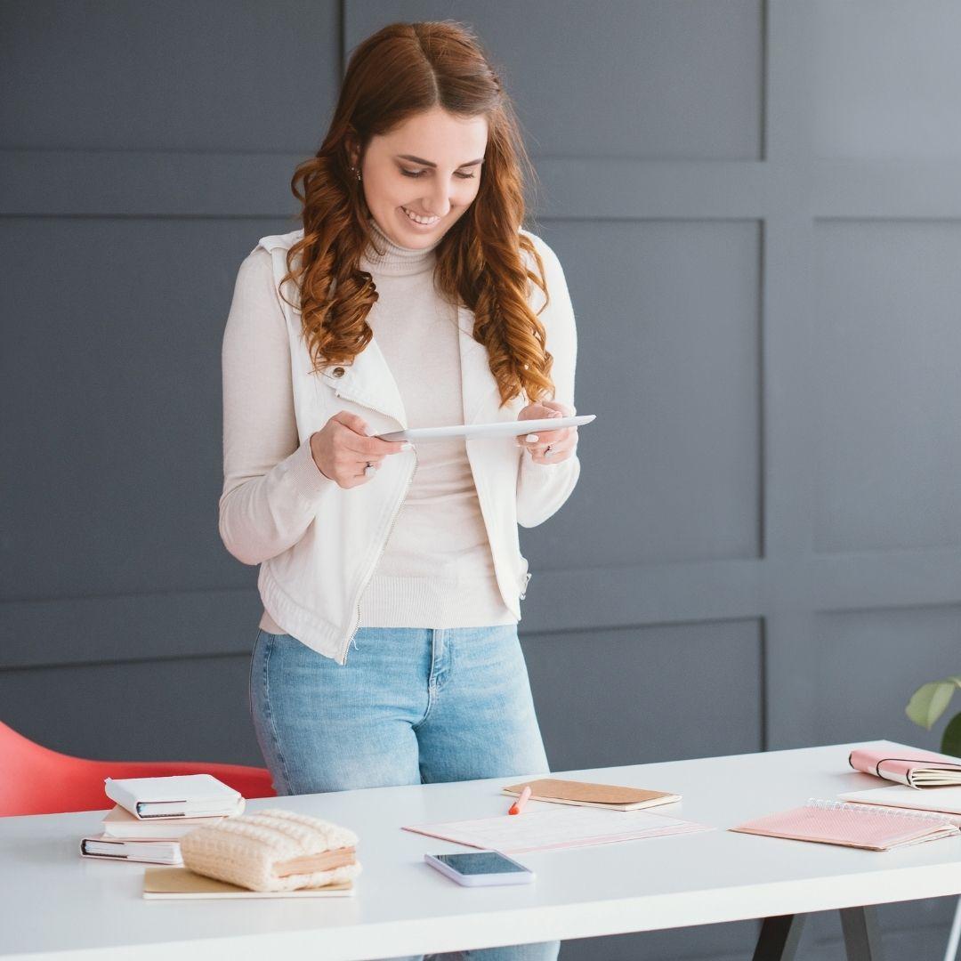 woman looking at tablet