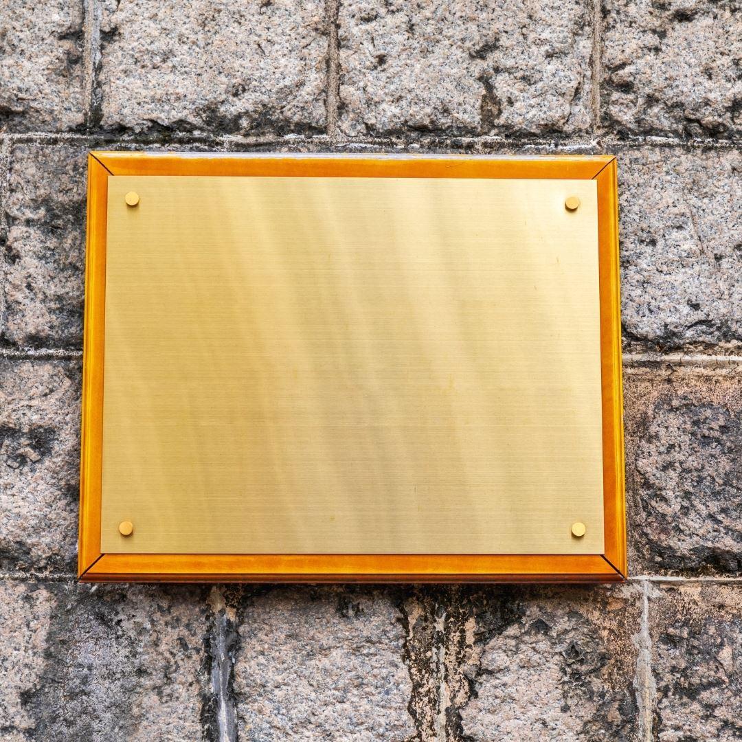 golden plaque awaiting engraving