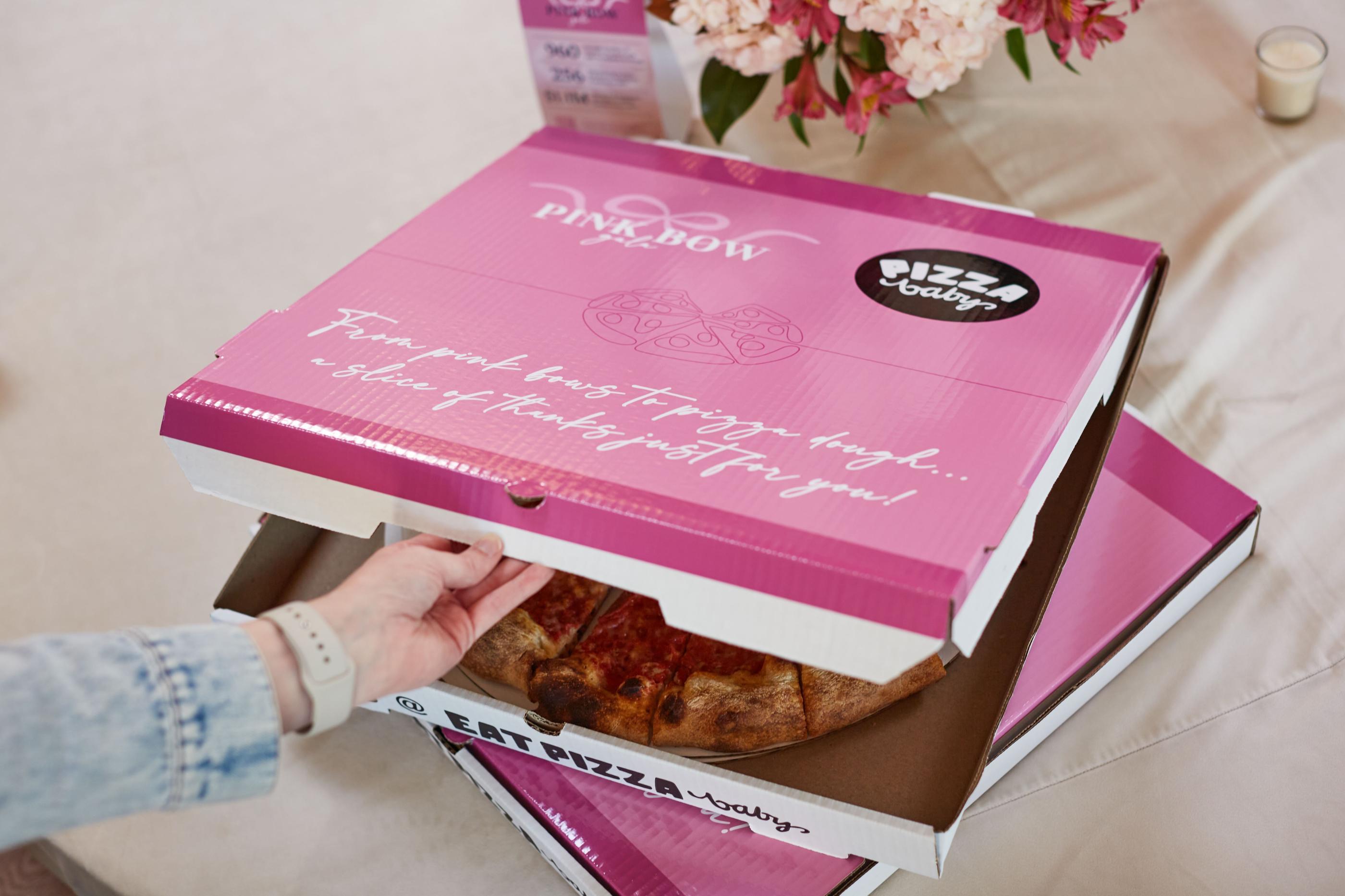 A custom branded pizza box for the Pink Bow Gala