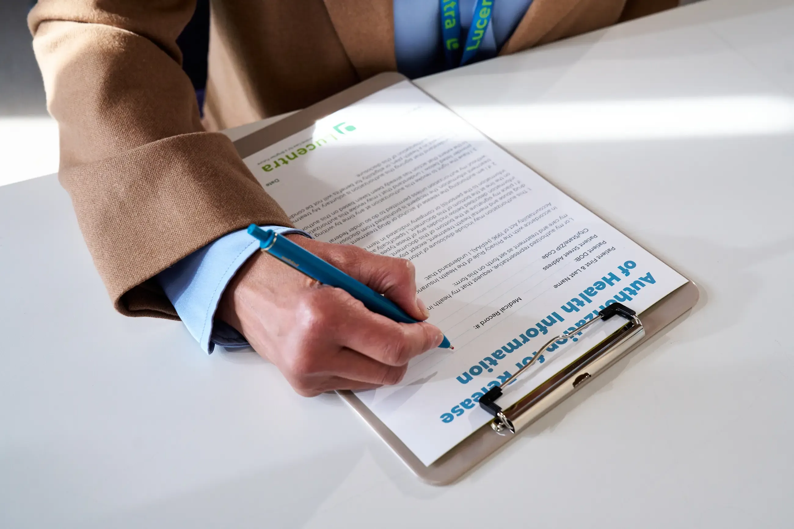 A person filling out a form