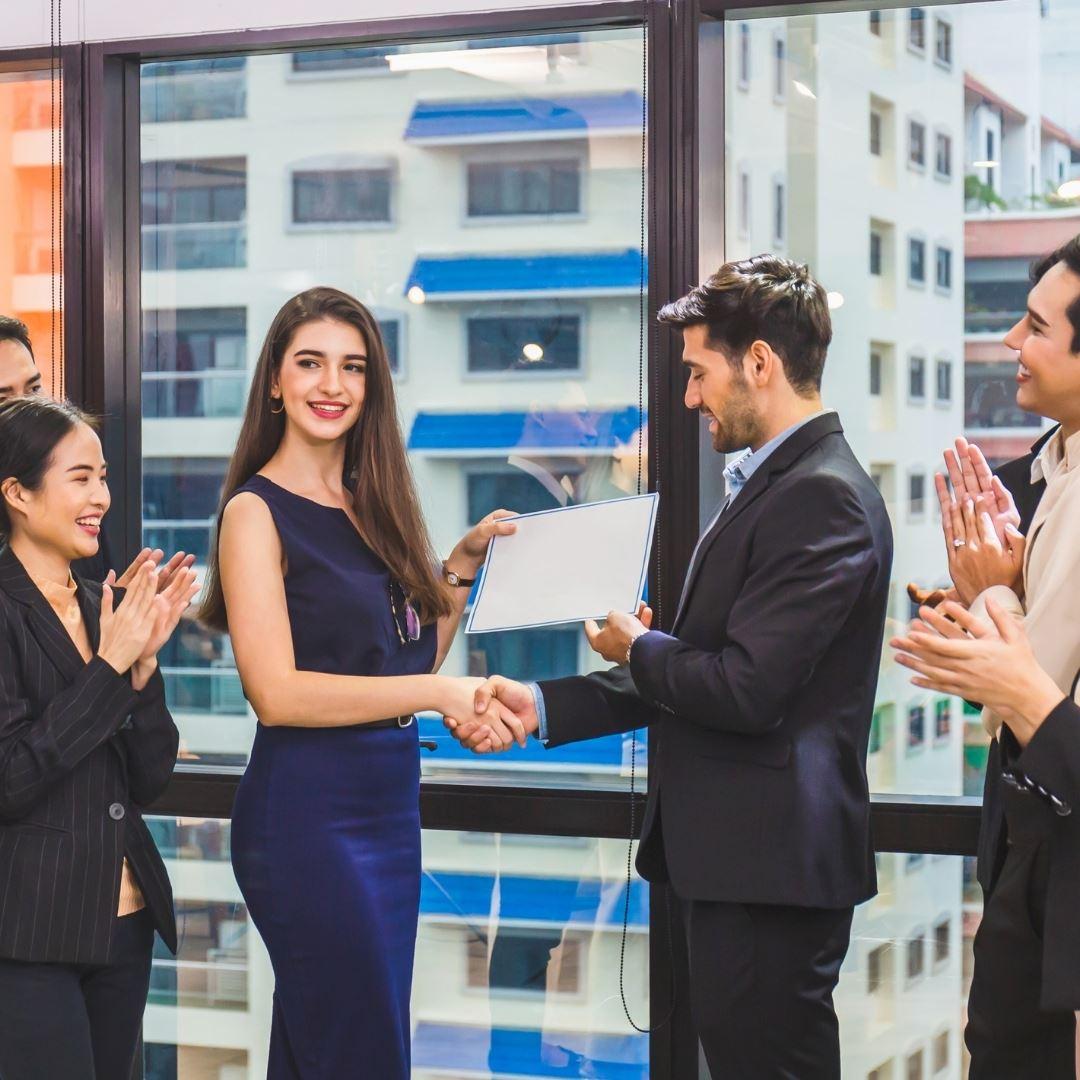 woman being awarded custom plaque