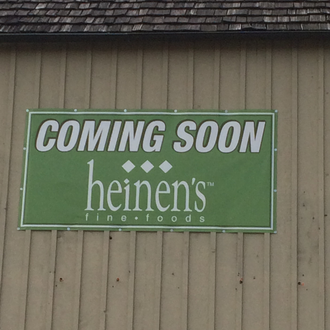big green sign on building