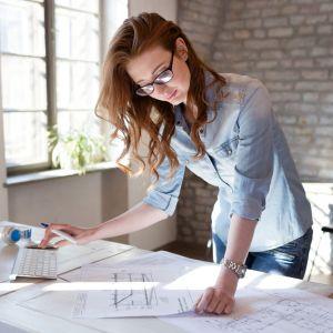 An architect looking at blueprints