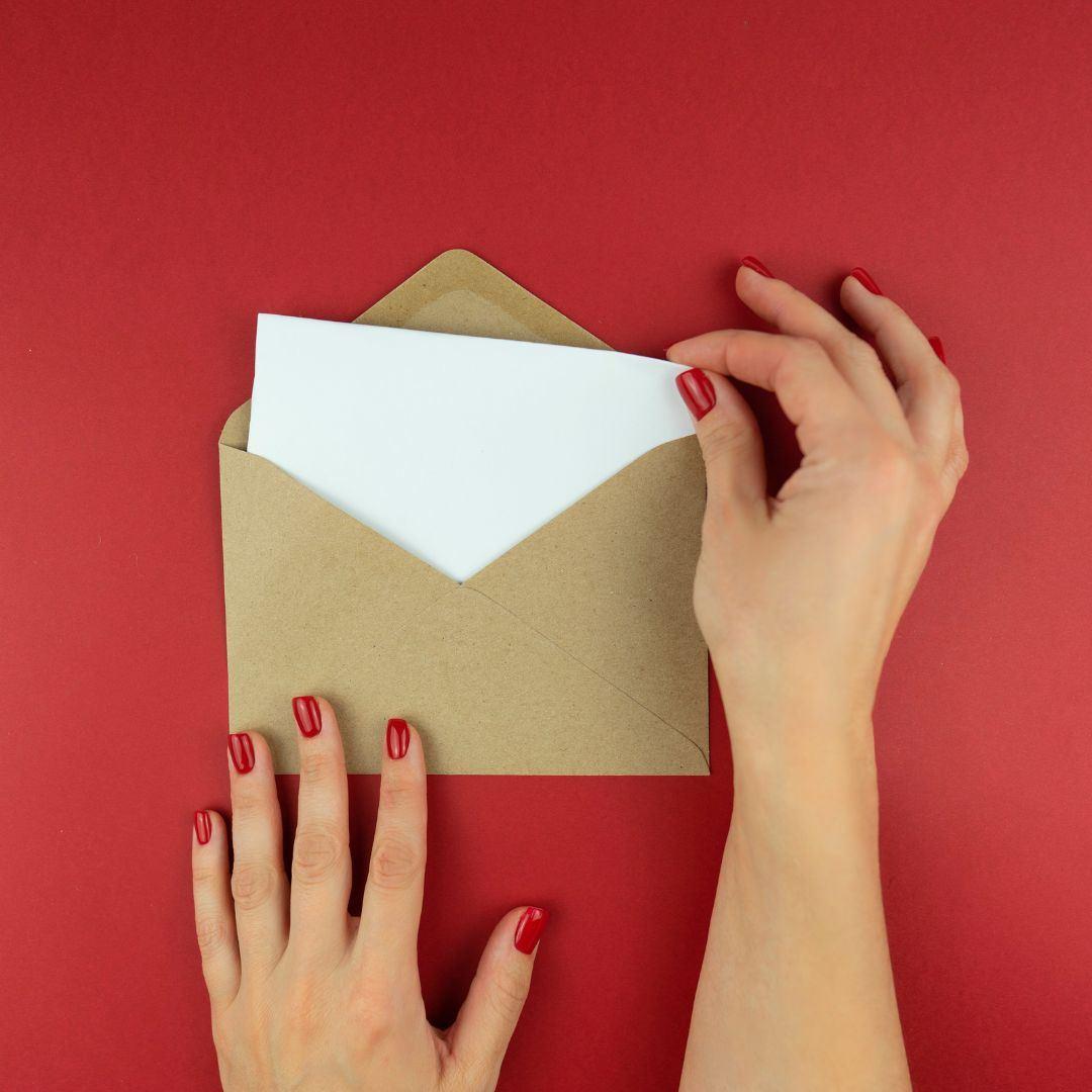 woman opening letter