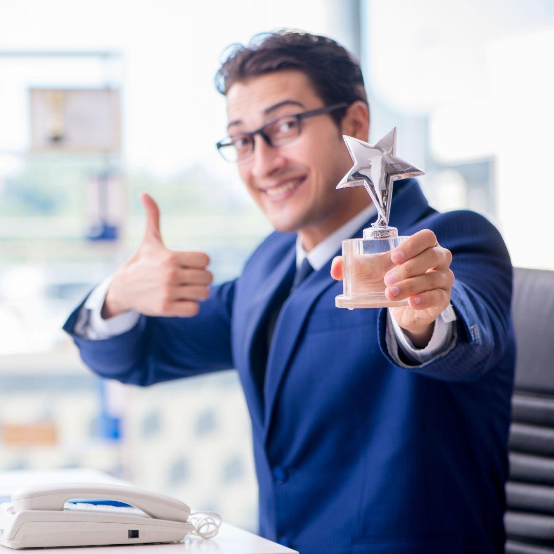 man holding custom award