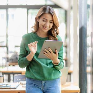 A businesswoman on her tablet in the office