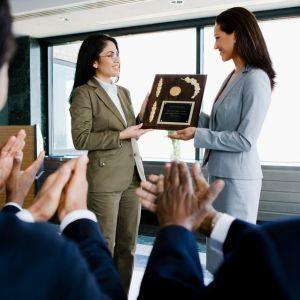 Woman receiving an award at a convention