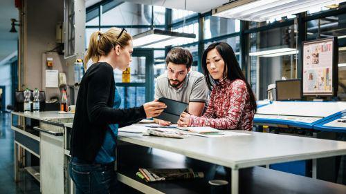 A group of professional printers at a desk