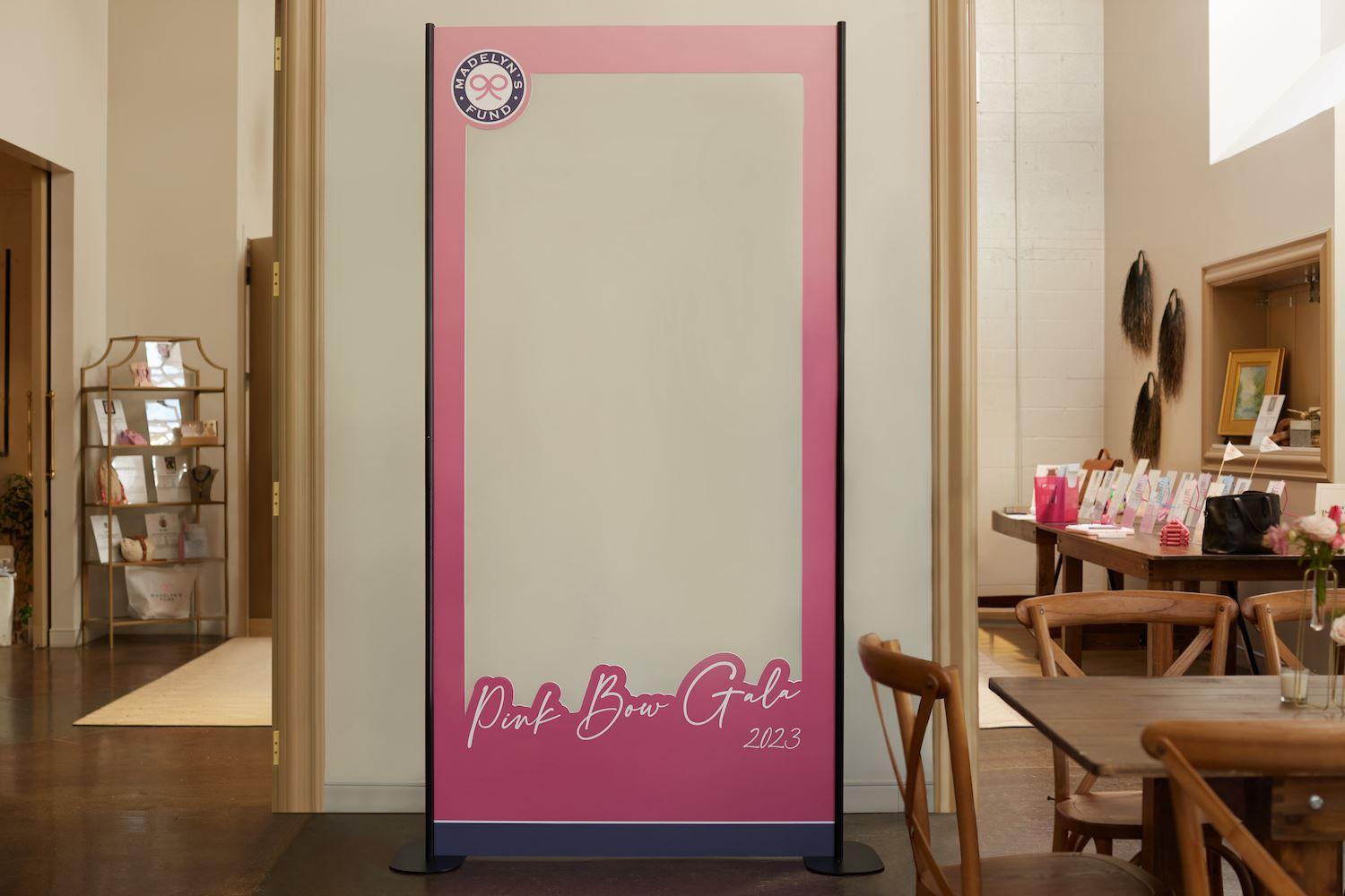 A Barbie box-style photo prop for the Pink Bow Gala