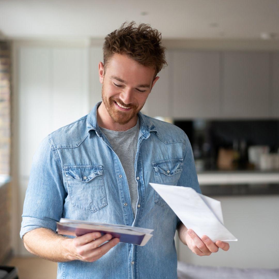 man looking at mail