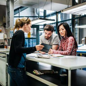Printing professionals at a desk