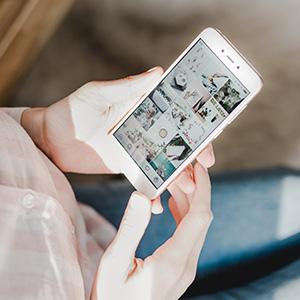 A woman looking at social media on her phone