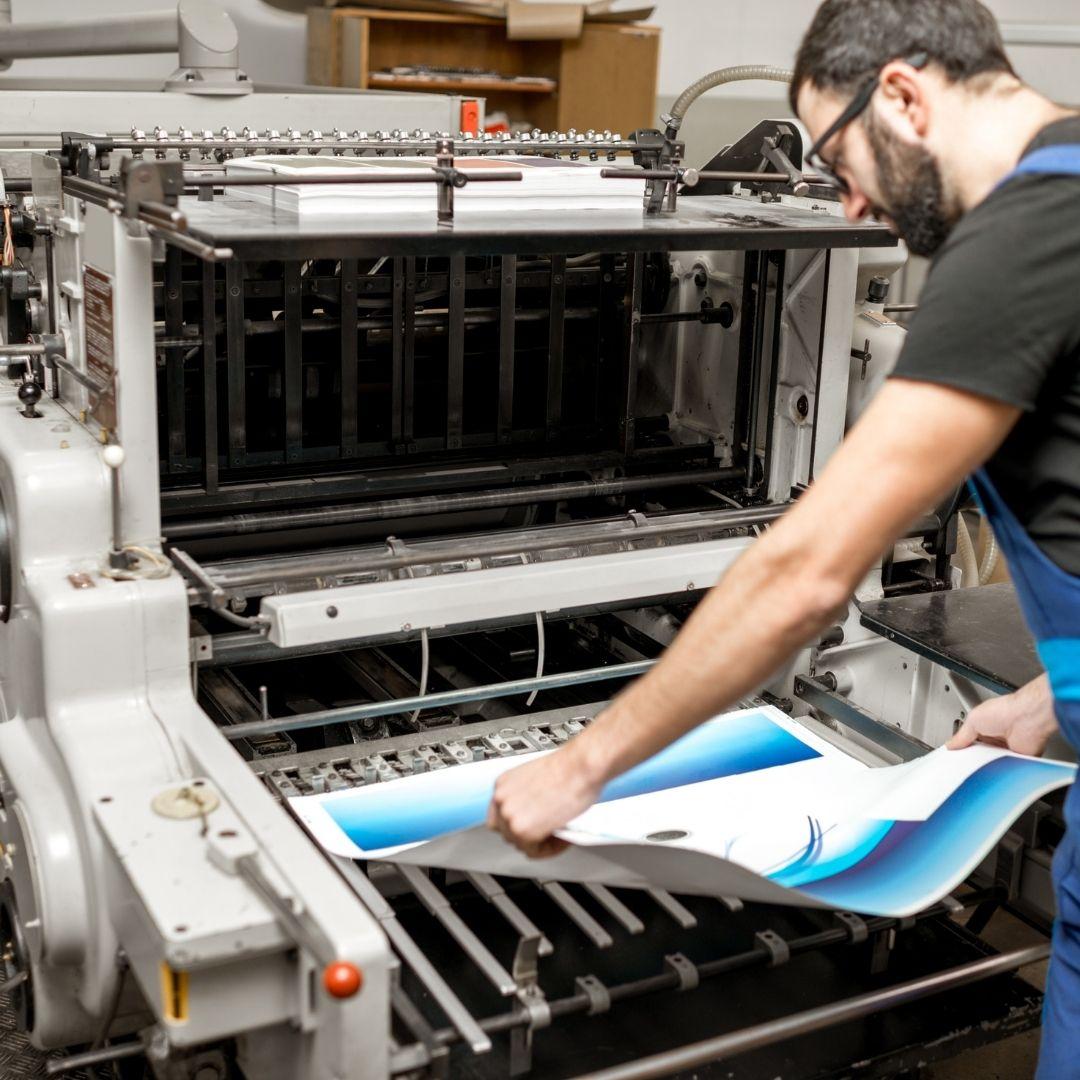 man looking at large print