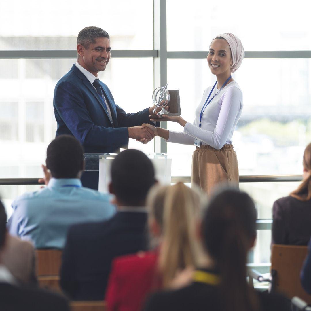person handing out an award