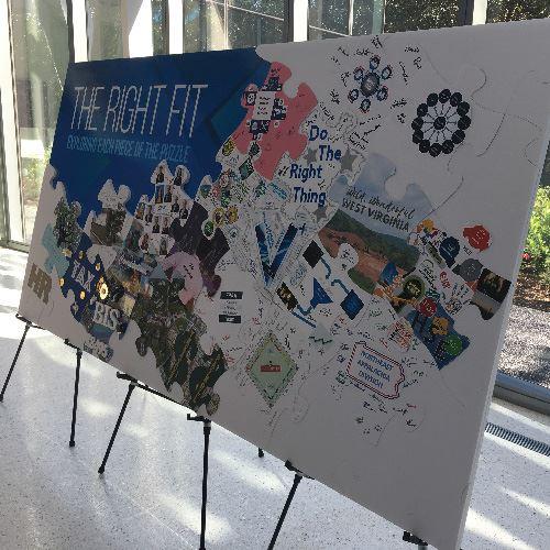 A sign is made up of puzzle pieces that are designed and drawn on