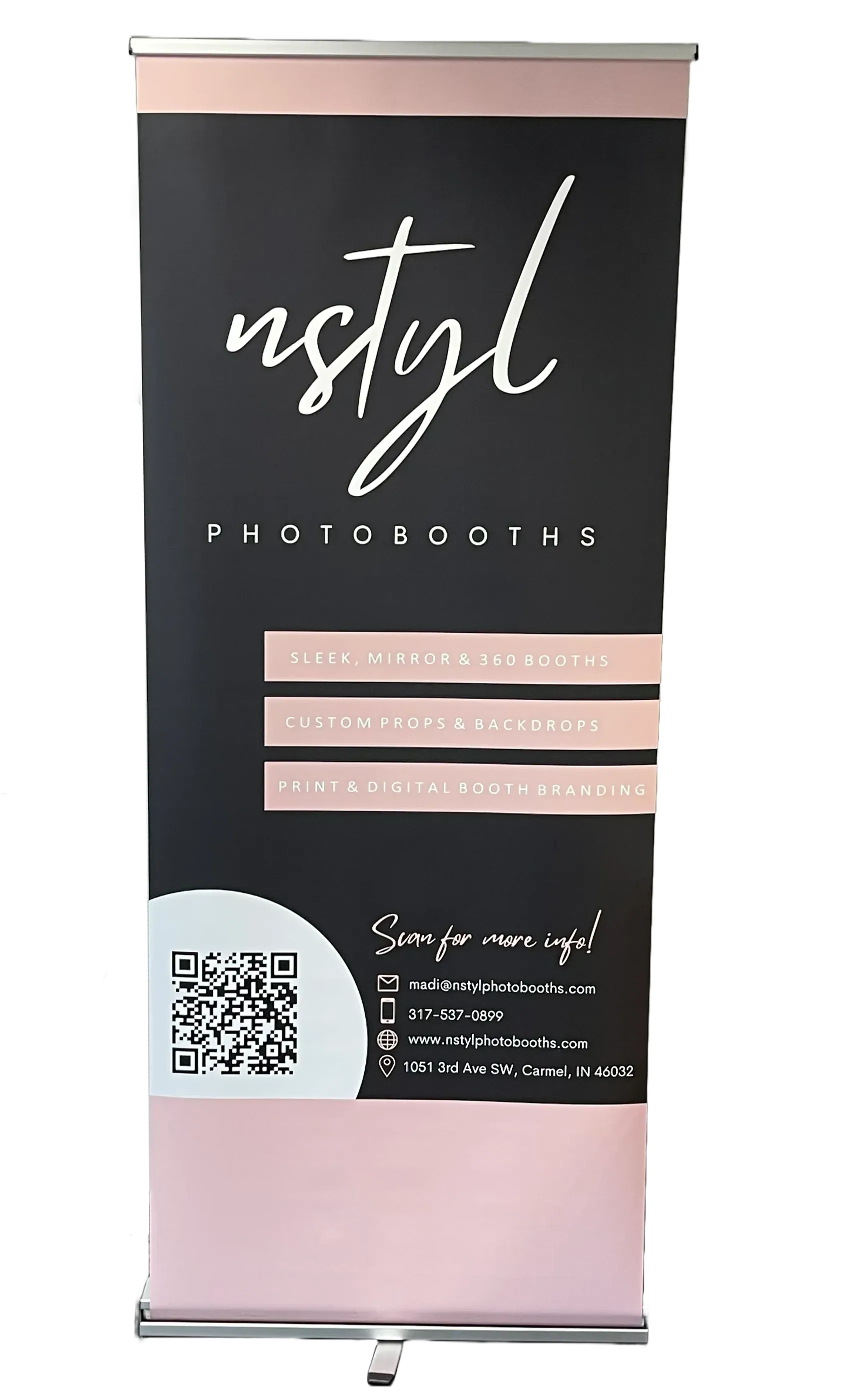 Branded retractable banner for Nstyl Photobooths featuring services offered, contact information, and a QR code for more info.