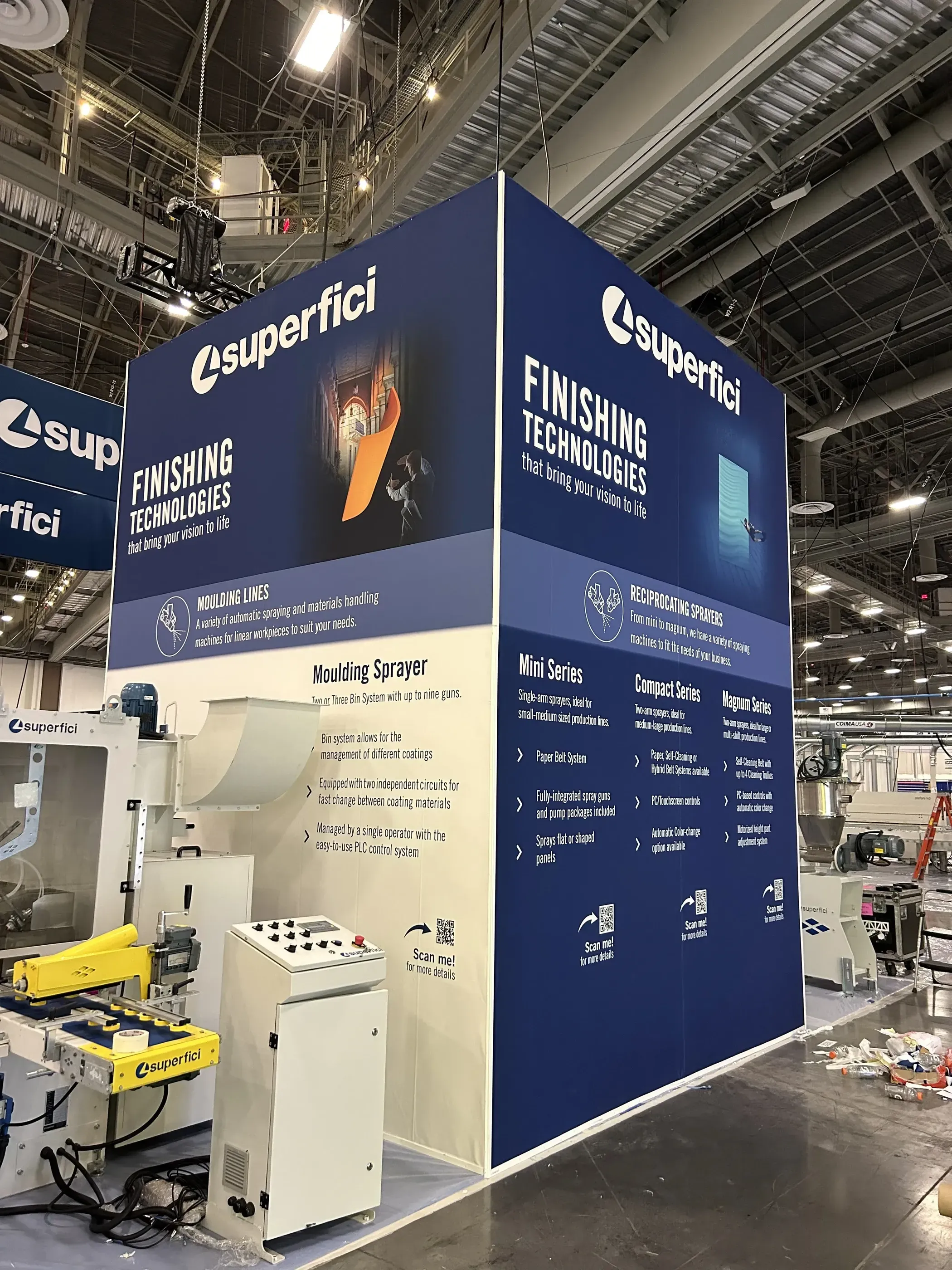 Superfici trade show booth backdrop highlighting finishing technologies.